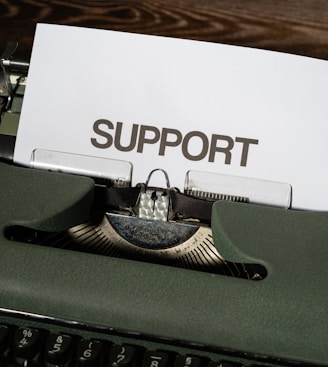 a close up of a typewriter with a paper on it