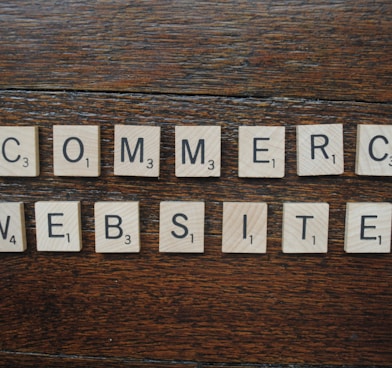 a group of white letters on a wooden surface